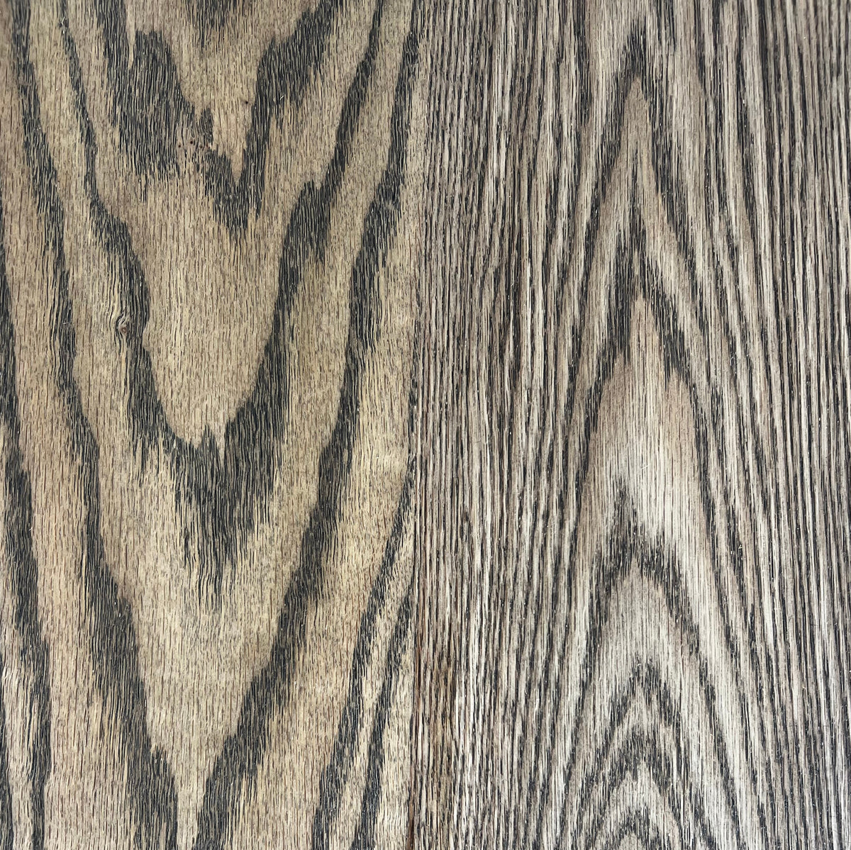 Close-up of American Oak hardwood in dark walnut stain, showing the grain and finish
