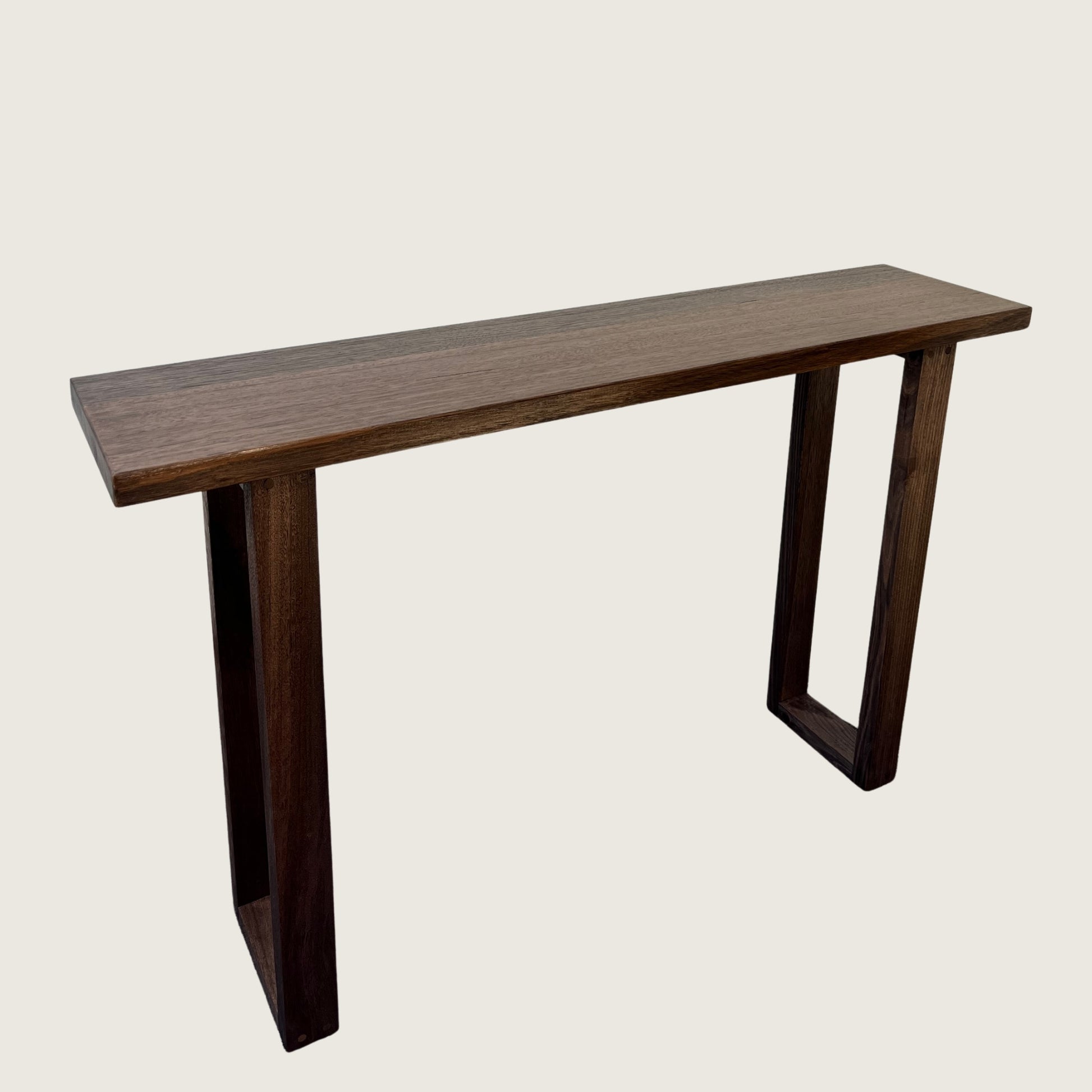 Dark Oak Classic Hallway Table — a dark hardwood console table with U-shaped legs on a light background