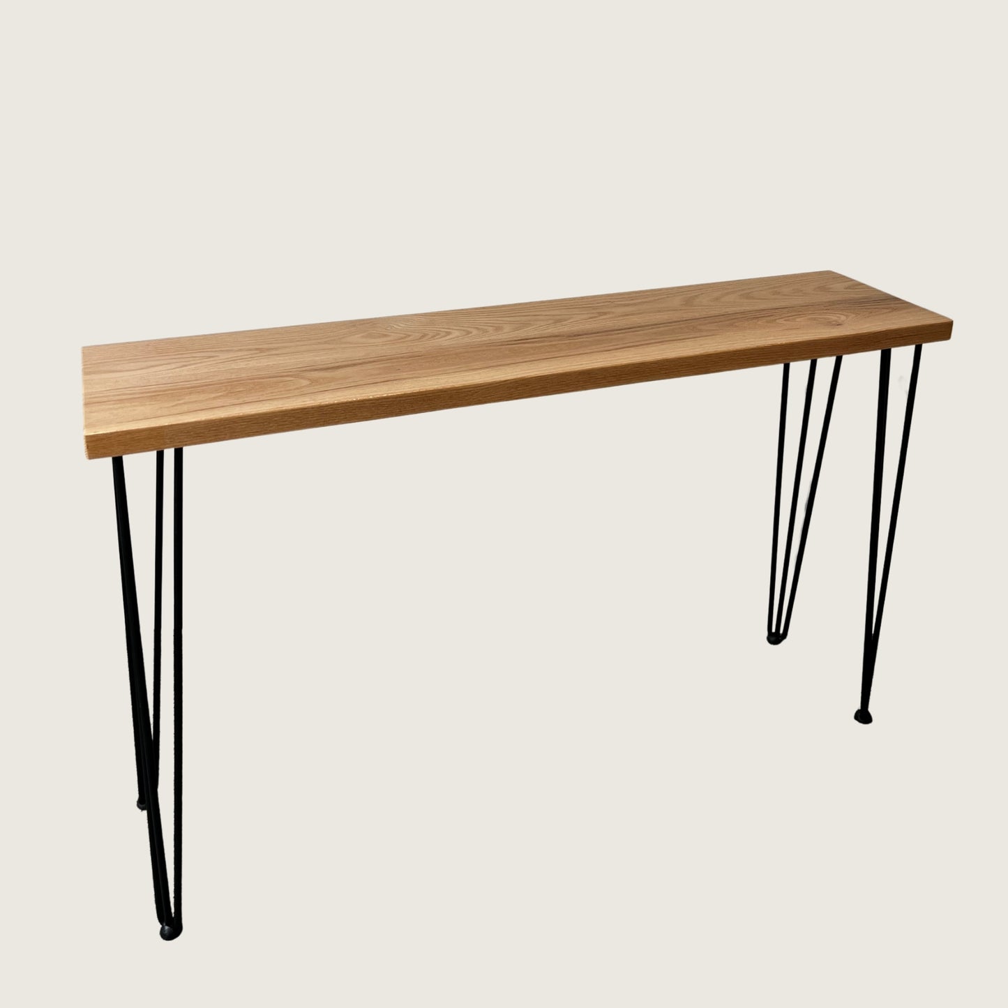 American Oak Modern Hallway Table — angled view showing steel hairpin legs and natural American Oak timber top