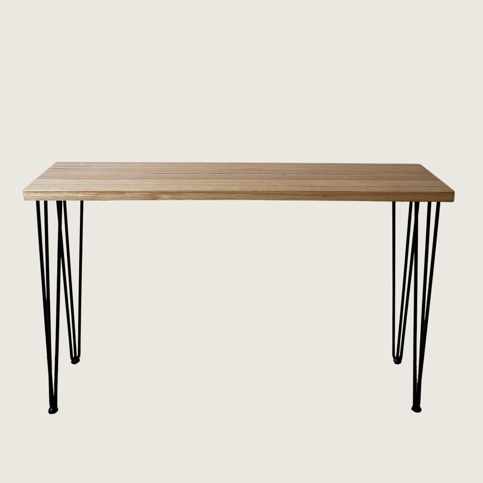 Tasmanian Oak Modern Hallway Table — angled view showing steel hairpin legs and natural Tasmanian Oak timber top