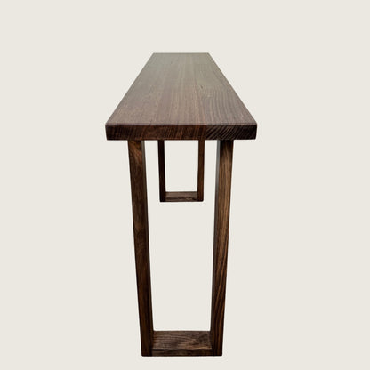 Dark Oak Classic Hallway Table — a dark hardwood console table with ski legs, side view on a light background