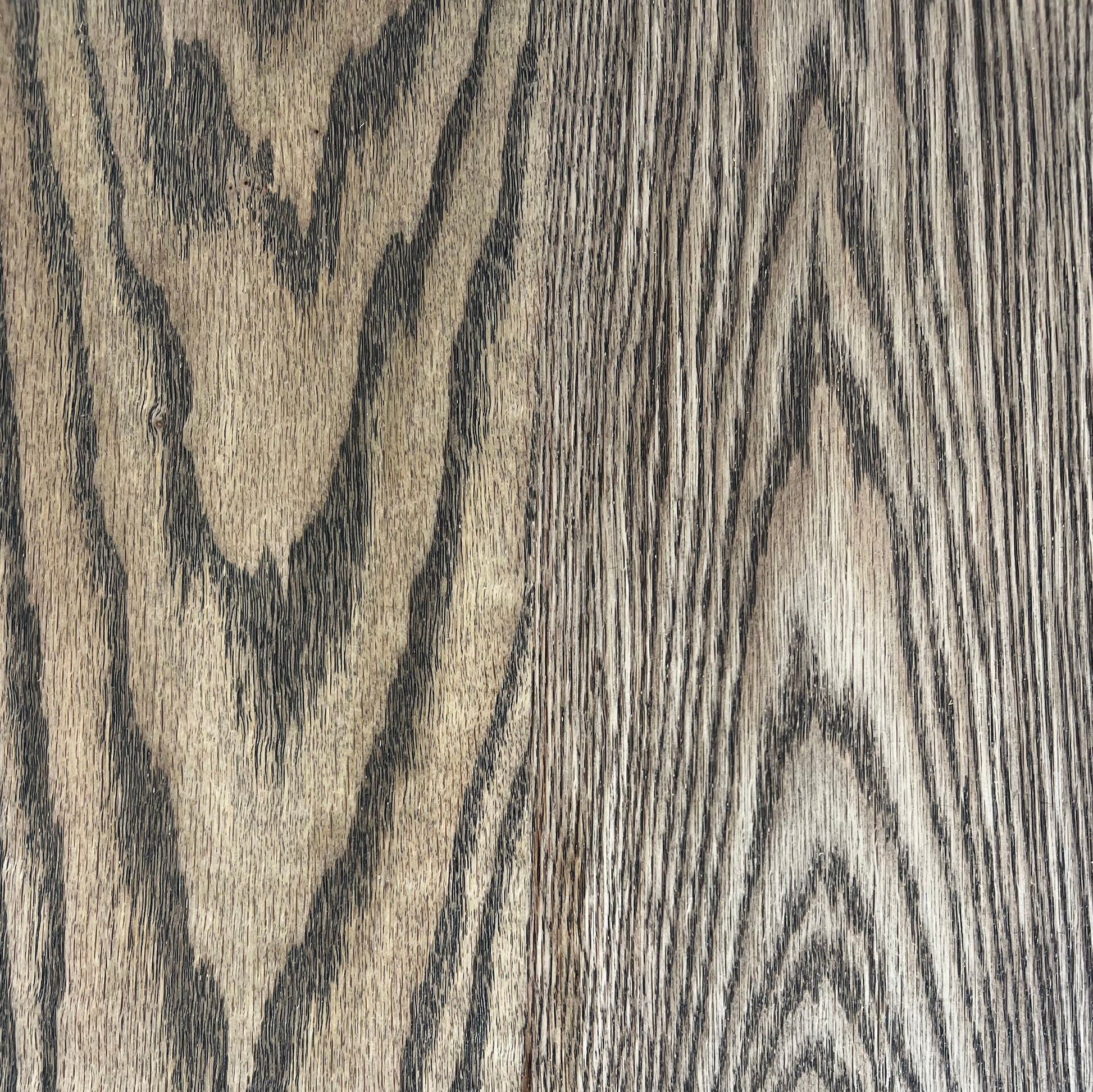 Close-up of American Oak hardwood in dark walnut stain, showing the grain and finish