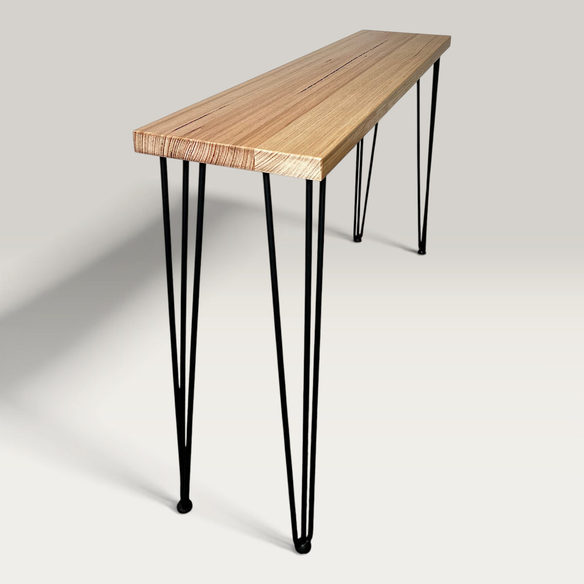 Tasmanian Oak Modern Hallway Table — side view showing steel hairpin legs and natural Tasmanian Oak timber 