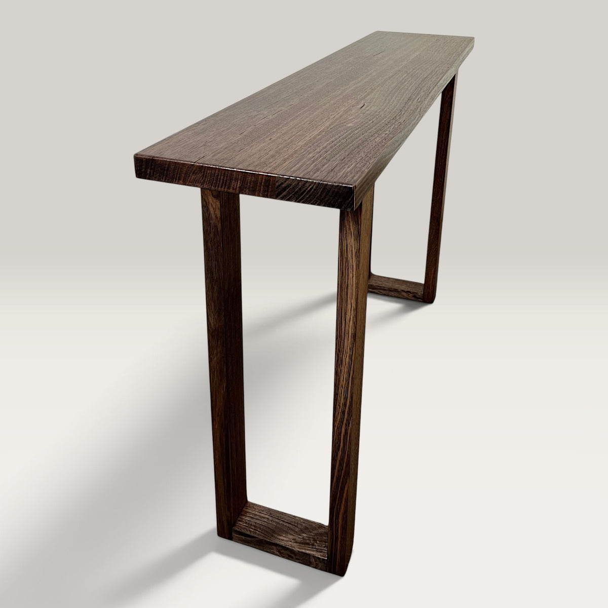 Dark Oak Classic Hallway Table — a dark hardwood console table angled view with a light background